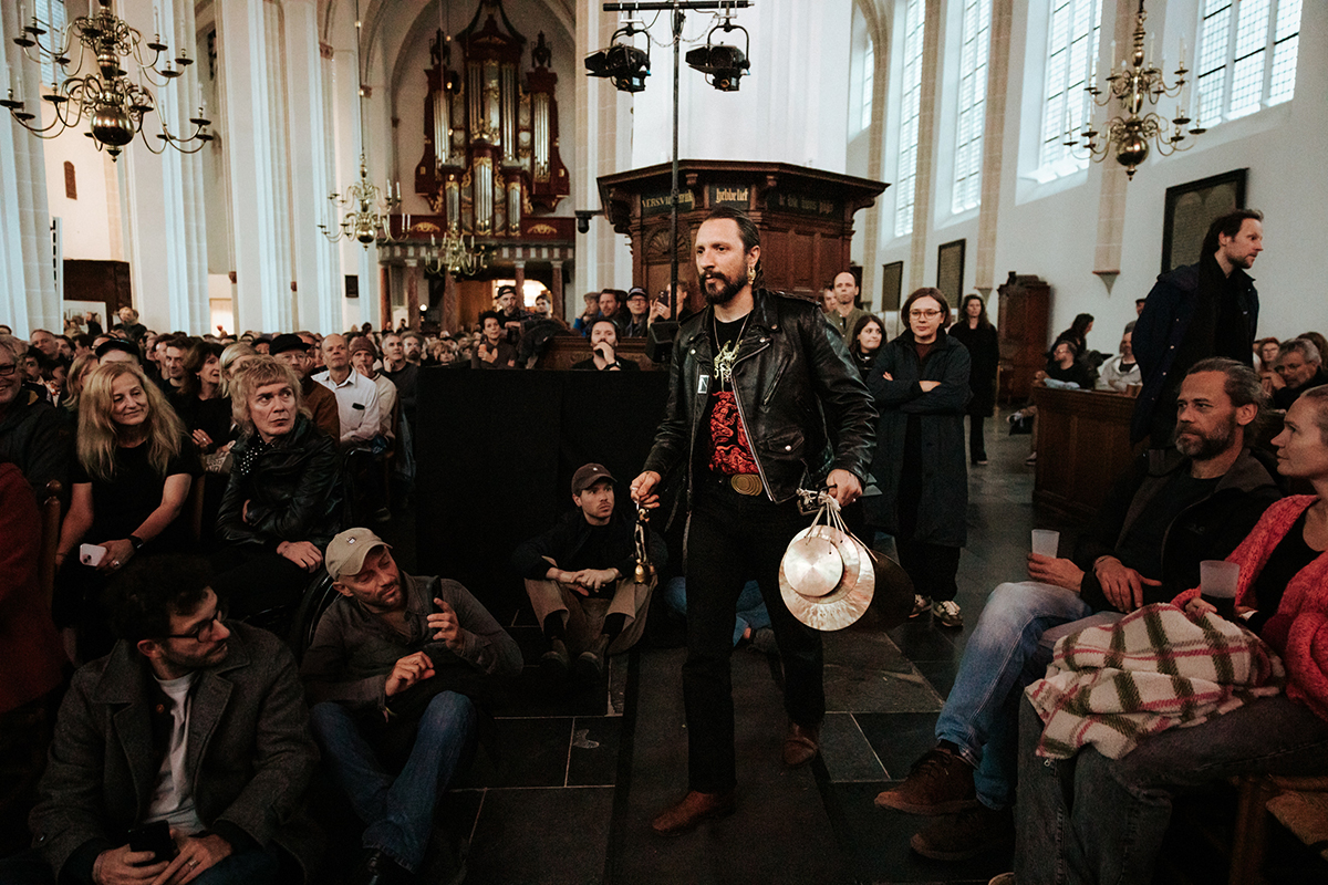 One of the members of ZA&Auml;AR walking amongst the crowd in the Jacobi church during the performance at Le Guess Who?